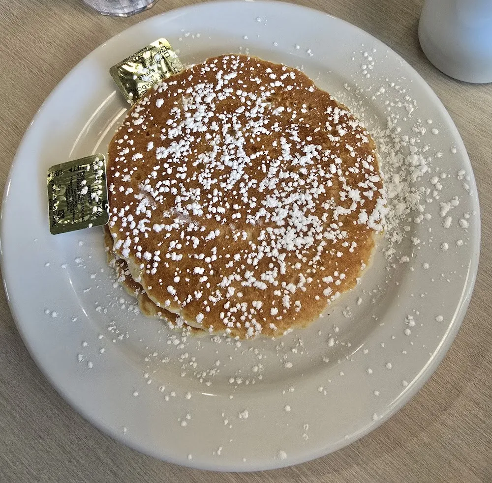 Golden Pancakes with Powdered Sugar